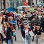 People holding placards with climate change messages on during a climate march